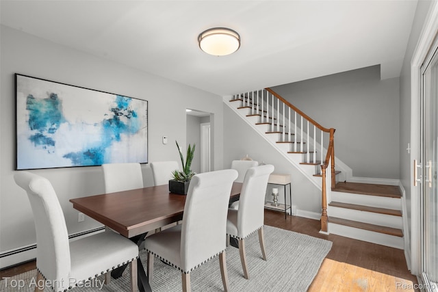 1593 Parke St, Rochester Hills, MI 48307 - dining space with stairs, wood finished floors, and a baseboard radiator