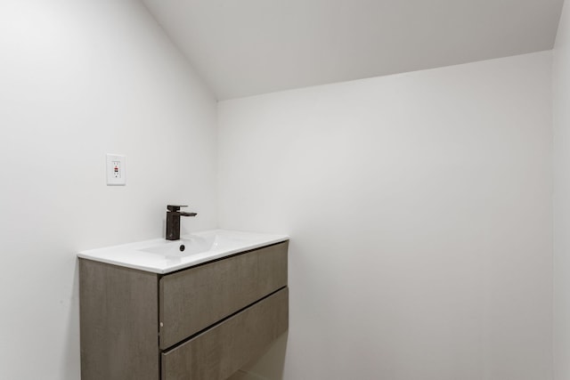 1680 Kalamazoo Ave SE, Grand Rapids, MI 49507 - bathroom with vanity and vaulted ceiling