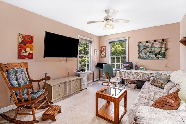 4673 Chasemoor Dr, Portage, MI 49024 - living area featuring a desk, a ceiling fan, and carpet