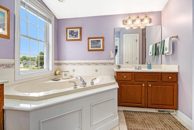 4673 Chasemoor Dr, Portage, MI 49024 - full bathroom featuring vanity, a bath, and tile patterned flooring