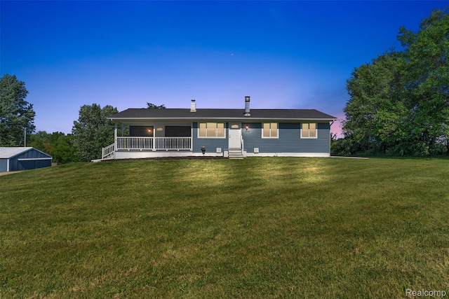7900 Wiggins Rd, Howell, MI 48855 - back of house featuring a yard