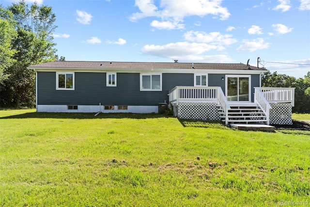 7900 Wiggins Rd, Howell, MI 48855 - back of property featuring a deck and a yard