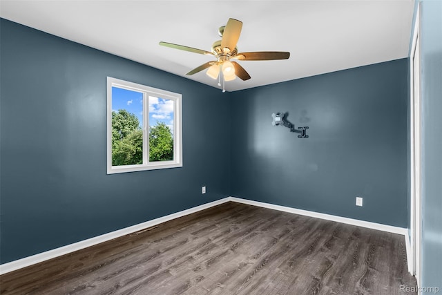 7900 Wiggins Rd, Howell, MI 48855 - spare room featuring dark wood finished floors and a ceiling fan
