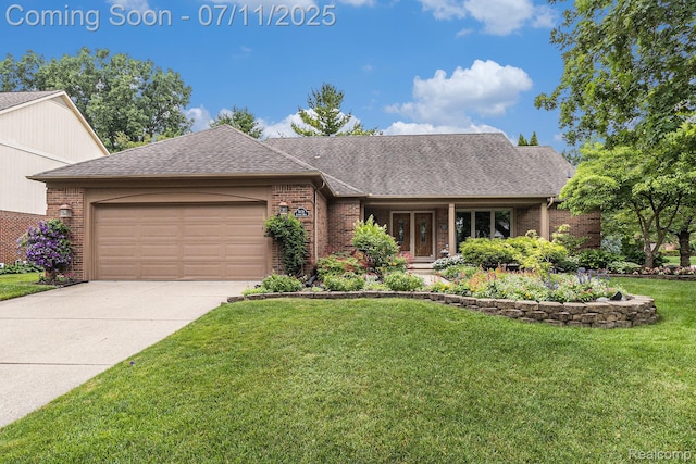 5131 Standish Dr, Troy, MI 48085 - view of front of house featuring brick siding, an attached garage, a front lawn, concrete driveway, and roof with shingles