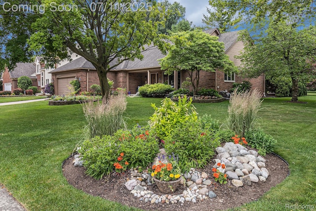 5131 Standish Dr, Troy, MI 48085 - obstructed view of property with brick siding, an attached garage, and a front lawn