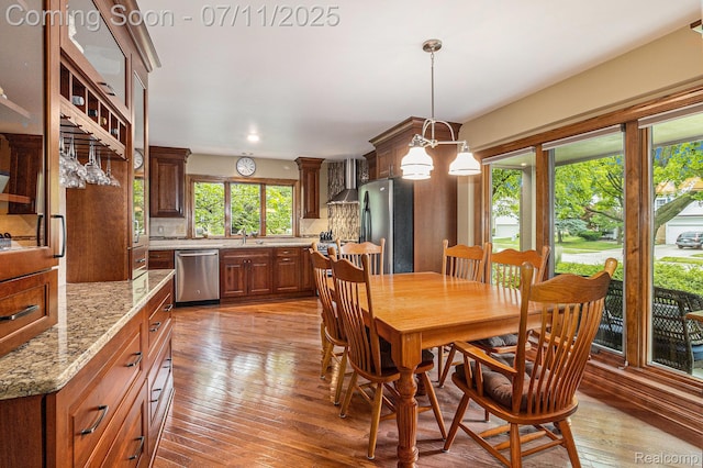 5131 Standish Dr, Troy, MI 48085 - dining space with light wood finished floors, a chandelier, and recessed lighting