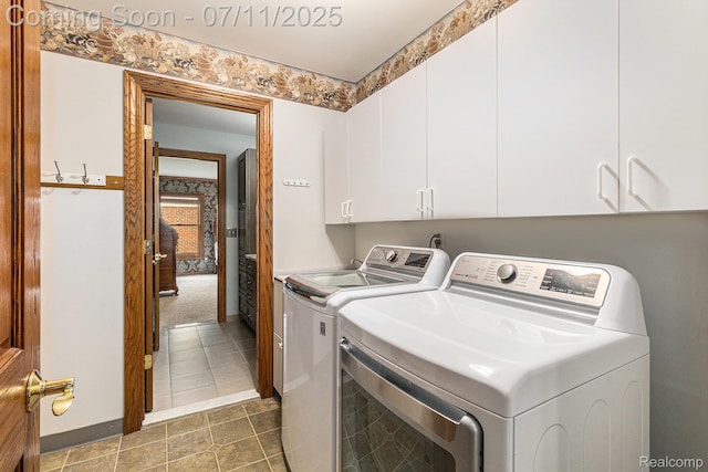 5131 Standish Dr, Troy, MI 48085 - washroom with washer and dryer, cabinet space, and tile patterned floors
