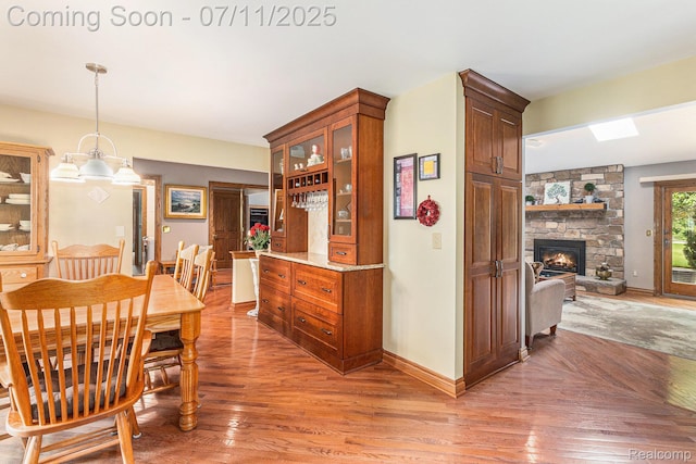 5131 Standish Dr, Troy, MI 48085 - dining room featuring light wood-style floors and a fireplace