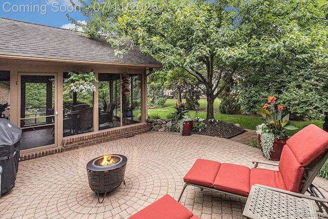 5131 Standish Dr, Troy, MI 48085 - view of patio / terrace featuring a fire pit and a sunroom