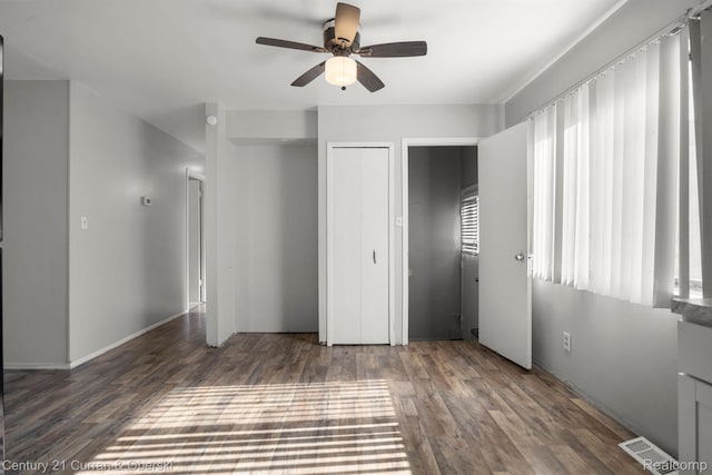 18949 Kenosha St, Harper Woods, MI 48225 - unfurnished bedroom with wood finished floors, a ceiling fan, and a closet