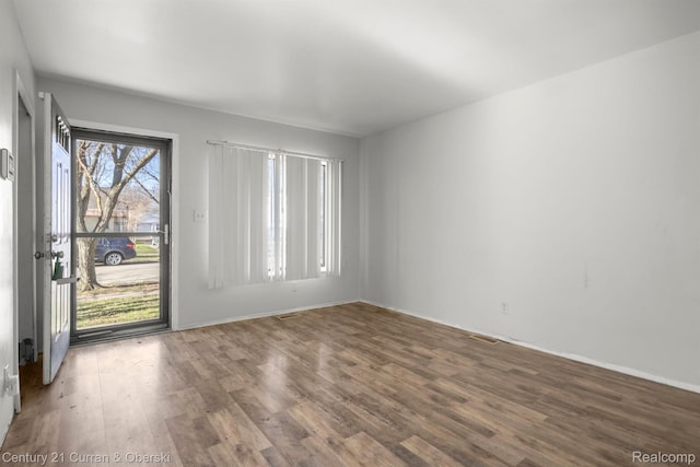 18949 Kenosha St, Harper Woods, MI 48225 - spare room with wood finished floors