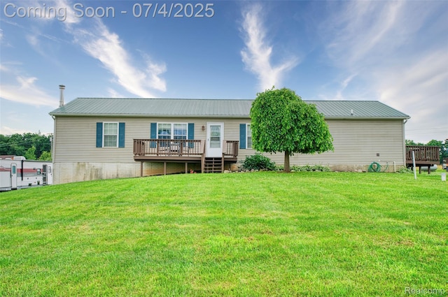 5771 Milett Rd, Fowlerville, MI 48836 - rear view of property with a deck, a metal roof, and a yard