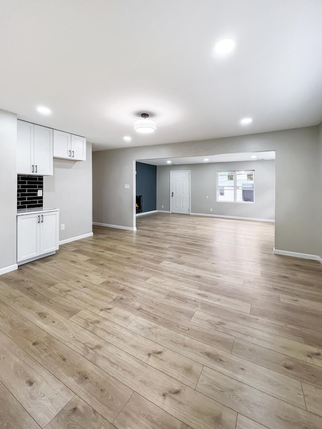 20283 Lancaster St, Harper Woods, MI 48225 - unfurnished living room with recessed lighting and light wood-style floors