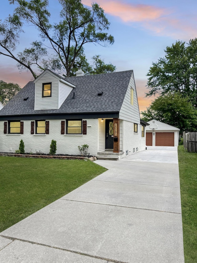 20283 Lancaster St, Harper Woods, MI 48225 - view of front of property with an outdoor structure, brick siding, a shingled roof, a detached garage, and a lawn