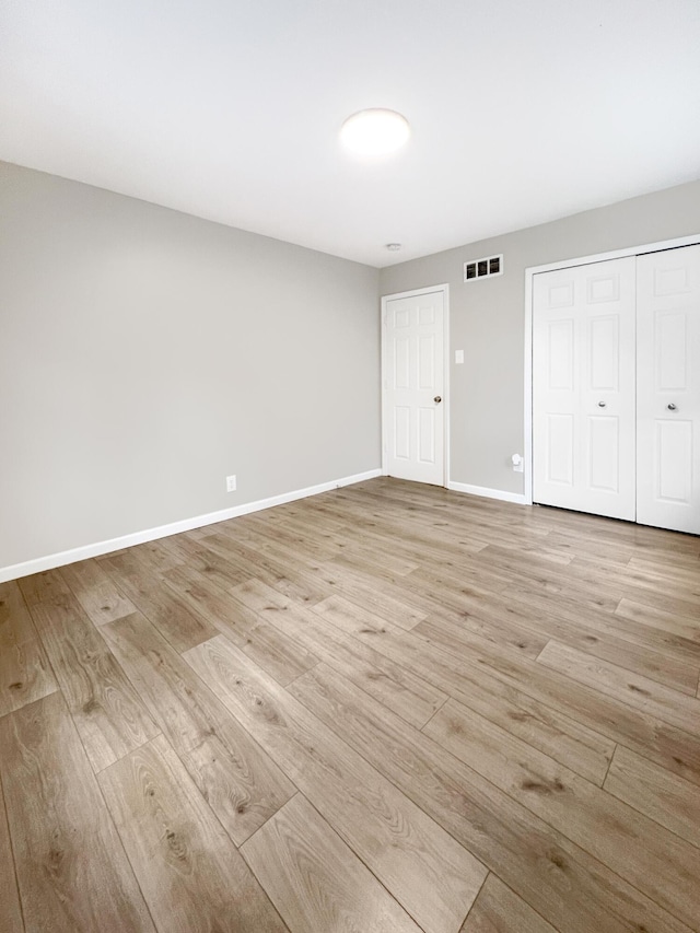 20283 Lancaster St, Harper Woods, MI 48225 - unfurnished bedroom with light wood-style flooring and a closet