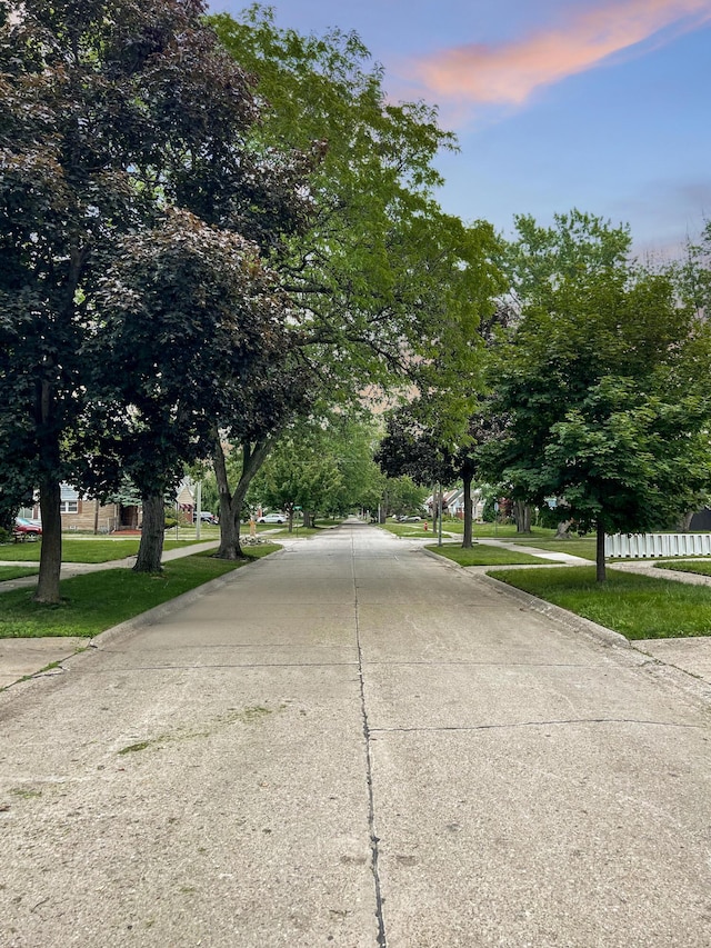 20283 Lancaster St, Harper Woods, MI 48225 - view of concrete road featuring curbs and sidewalks