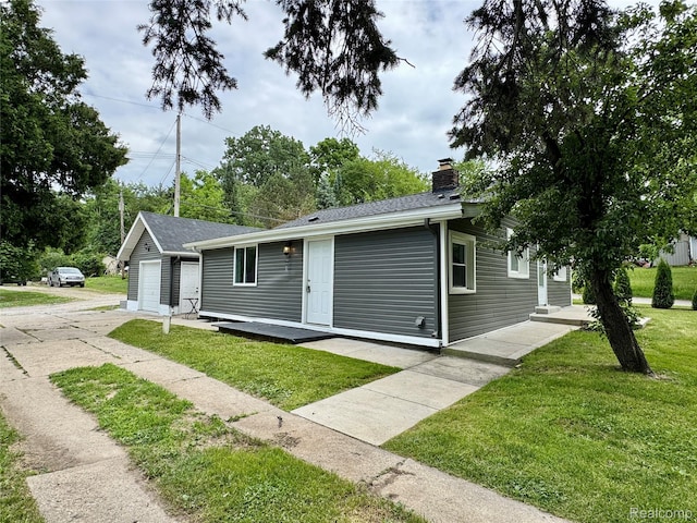 4915 Clarkston Rd, Clarkston, MI 48348 - view of front of house with a chimney and a front lawn