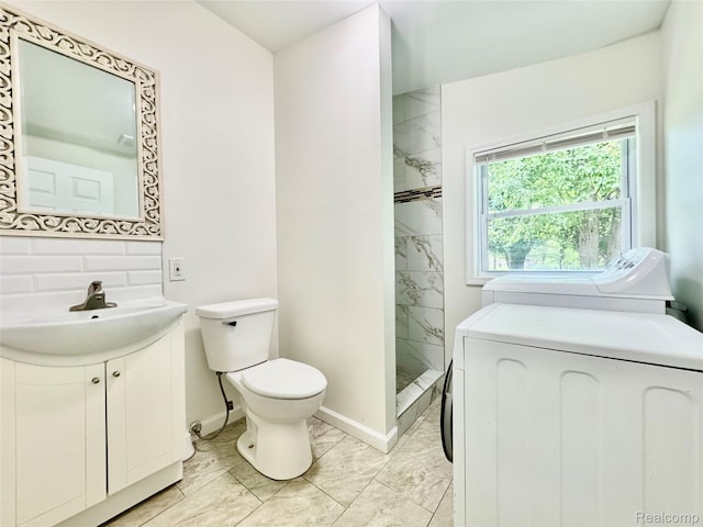 4915 Clarkston Rd, Clarkston, MI 48348 - bathroom featuring washer and clothes dryer, marble look tile flooring, vanity, a shower stall, and backsplash