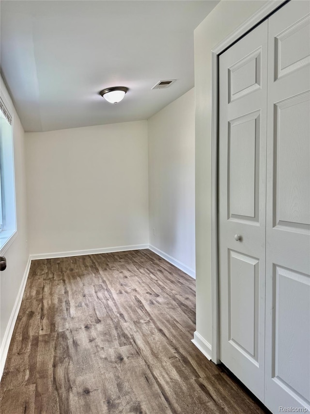4915 Clarkston Rd, Clarkston, MI 48348 - empty room featuring baseboards and dark wood-style floors