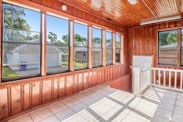 5369 Weddell St, Dearborn Heights, MI 48125 - unfurnished sunroom featuring tile patterned flooring, wood walls, and wooden ceiling