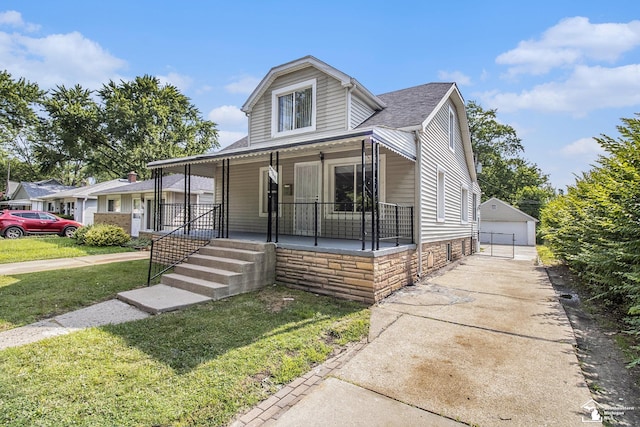 5369 Weddell St, Dearborn Heights, MI 48125 - bungalow with a porch, a front lawn, an outdoor structure, roof with shingles, and a detached garage