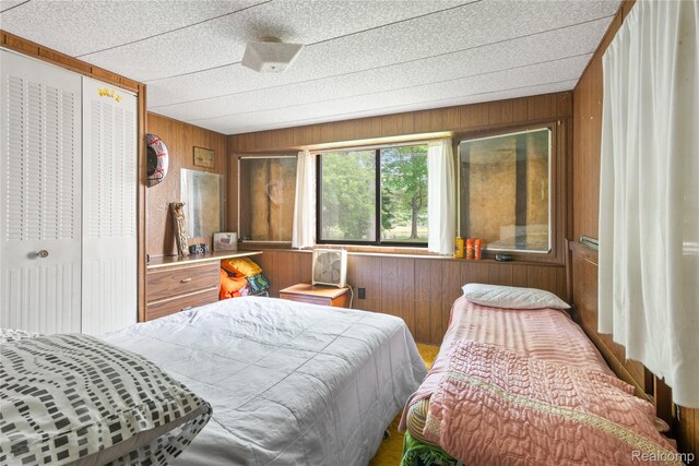 4175 Cherokee St, Gladwin, MI 48624 - bedroom with wooden walls