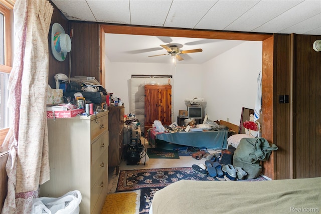 4175 Cherokee St, Gladwin, MI 48624 - bedroom featuring wood walls and ceiling fan