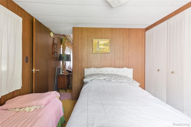 4175 Cherokee St, Gladwin, MI 48624 - bedroom with wood walls and carpet floors