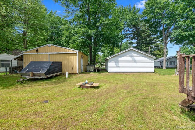 4175 Cherokee St, Gladwin, MI 48624 - view of grassy yard with an outdoor structure