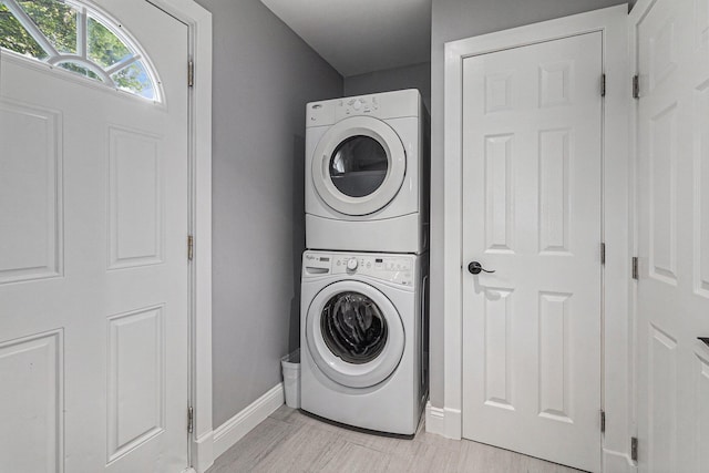 10351 Endicott St, Michigan, MI 48111 - laundry area featuring stacked washer / dryer and baseboards