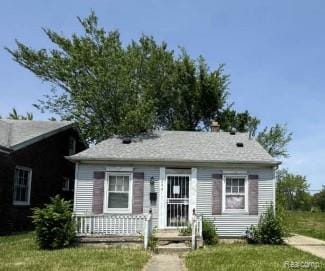 15421 Park Grove St, Detroit, MI 48205 - view of front facade featuring a front lawn and covered porch