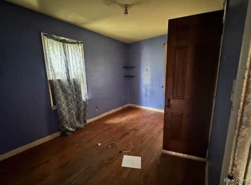 15421 Park Grove St, Detroit, MI 48205 - spare room featuring wood finished floors and baseboards