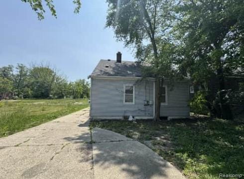15421 Park Grove St, Detroit, MI 48205 - rear view of house with a chimney
