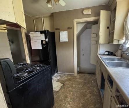 15421 Park Grove St, Detroit, MI 48205 - kitchen with black appliances, light countertops, and a ceiling fan