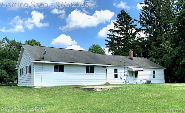 6201 S Main St, Clarkston, MI 48346 - back of house featuring a lawn and a chimney