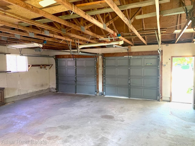 6201 S Main St, Clarkston, MI 48346 - garage featuring a garage door opener