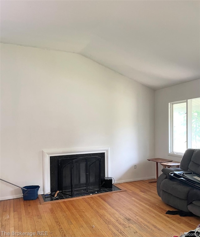 1934 Rockcreek Ln, Flint, MI 48507 - living room with light wood-style floors and lofted ceiling
