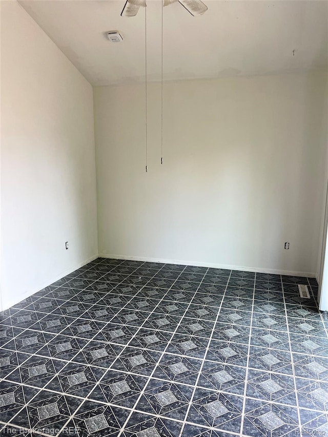 1934 Rockcreek Ln, Flint, MI 48507 - spare room featuring tile patterned flooring and a ceiling fan
