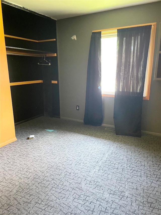 1934 Rockcreek Ln, Flint, MI 48507 - unfurnished bedroom with carpet flooring