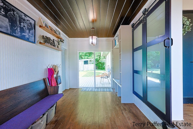 721 17 Mile Rd, Kent City, MI 49330 - hallway with a barn door, hardwood / wood-style flooring, and wooden ceiling