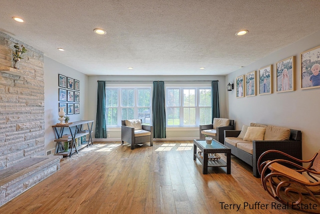 721 17 Mile Rd, Kent City, MI 49330 - living area with a textured ceiling, wood-type flooring, and recessed lighting