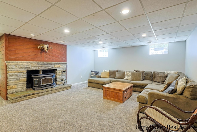 721 17 Mile Rd, Kent City, MI 49330 - carpeted living room featuring plenty of natural light, recessed lighting, a wood stove, and a paneled ceiling