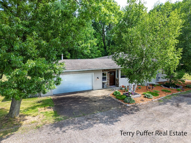 721 17 Mile Rd, Kent City, MI 49330 - view of front of house featuring asphalt driveway and a garage