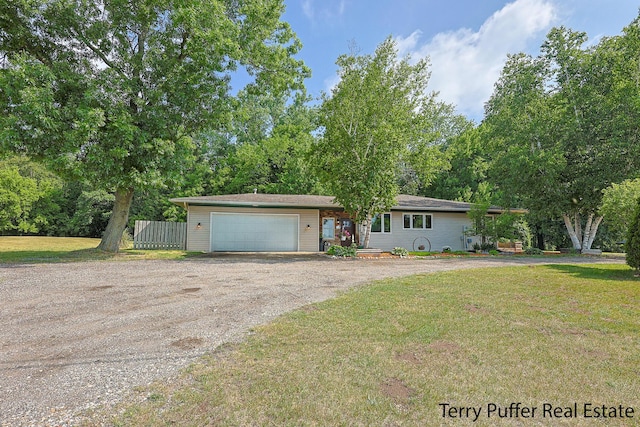 721 17 Mile Rd, Kent City, MI 49330 - view of front of house with dirt driveway and an attached garage