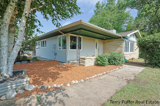 721 17 Mile Rd, Kent City, MI 49330 - view of front of house featuring stone siding
