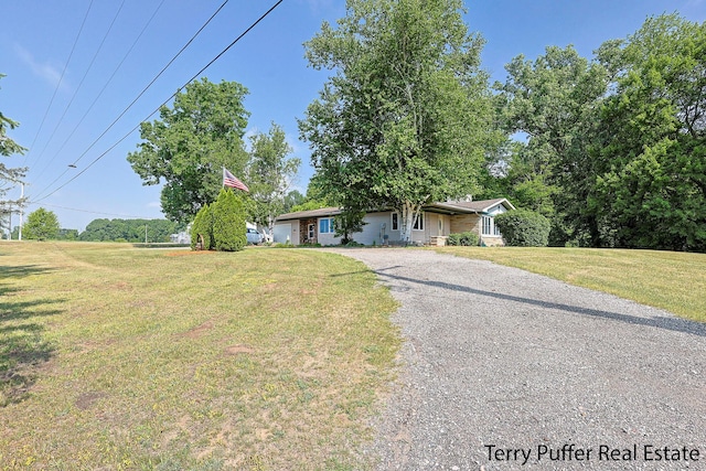 721 17 Mile Rd, Kent City, MI 49330 - view of front facade featuring gravel driveway and a front lawn