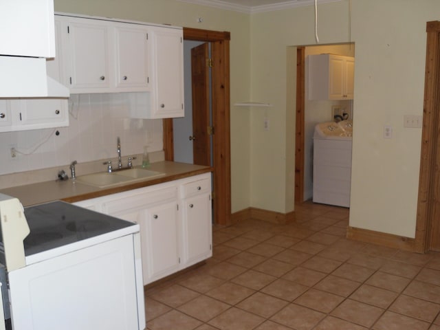 812 N Rath Ave, Ludington, MI 49431 - kitchen with washer / clothes dryer, range, decorative backsplash, premium range hood, and ornamental molding