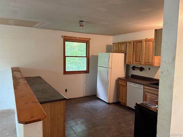 1185 E Hughes Lake Rd, Rose City, MI 48654 - kitchen with white appliances and dark countertops