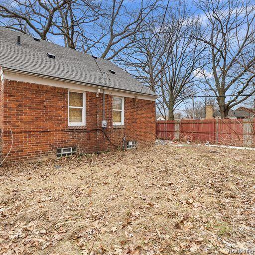 19405 Pierson St, Detroit, MI 48219 - rear view of house with brick siding and roof with shingles