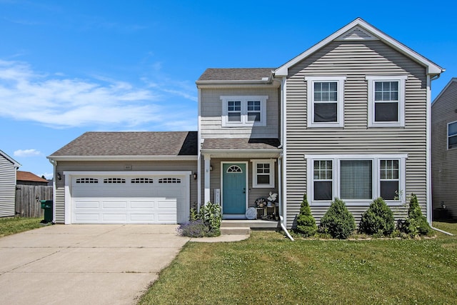 1619 Ives Mill Ln, Vicksburg, MI 49097 - traditional-style house with driveway, a garage, and a front lawn